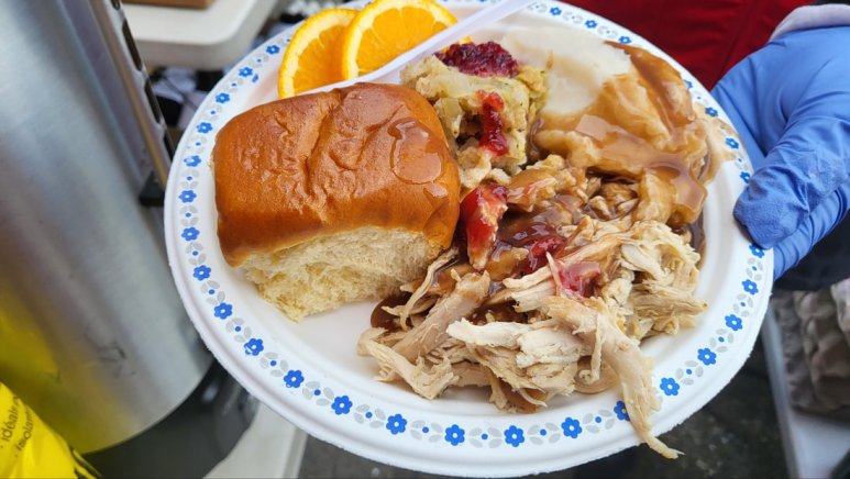 Serving a hot meal in the Downtown Eastside